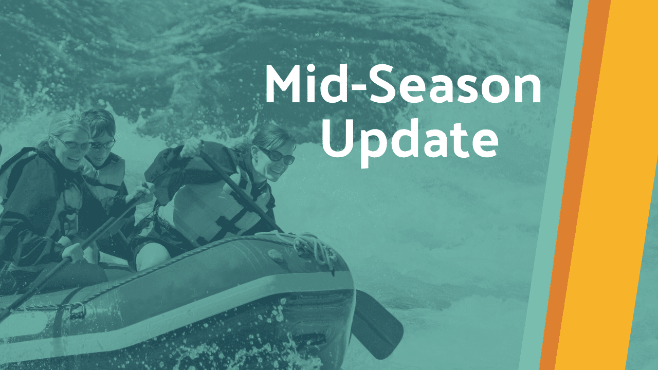 Background: A group of whitewater rafters are mid-rapids, with oars in the water and spray all around them. Foreground: Text overlay that says "Mid-Season Update" with Zebulon-colored orange and teal stripes.